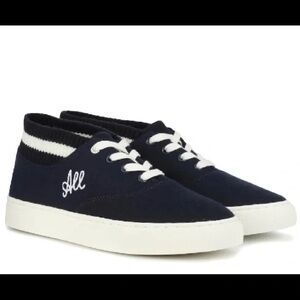“Love All” mid top Tory Sport by Tory Burch sneakers.